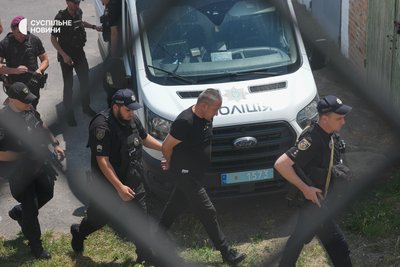 Guards escort former commander of the 155th OMR 