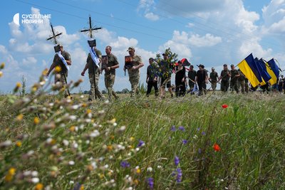 Comrades-in-arms of the murdered Maksym Moseychuk at the head of the funeral procession in Kalynivka, July 15, 2026