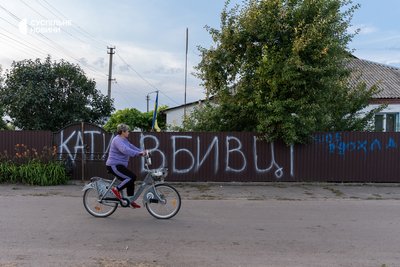 The fence of Ryabkina's property at the exit of the village directly opposite the Moseychuk brothers' dacha is also painted with inscriptions. Kalynivka, July 13, 2026