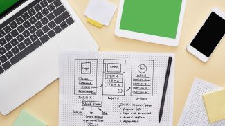 top view of gadgets near website design template on yellow background